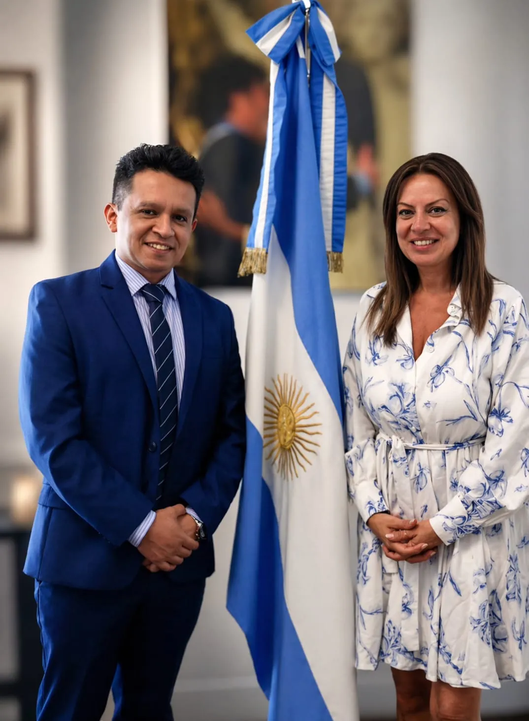 Diego Macana Roa with Sandra Pettovello and the Argentine flag